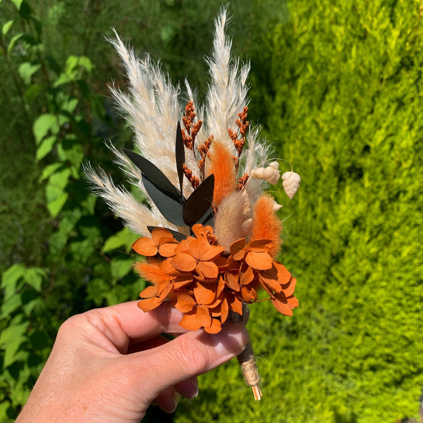 burnt orange buttonhole