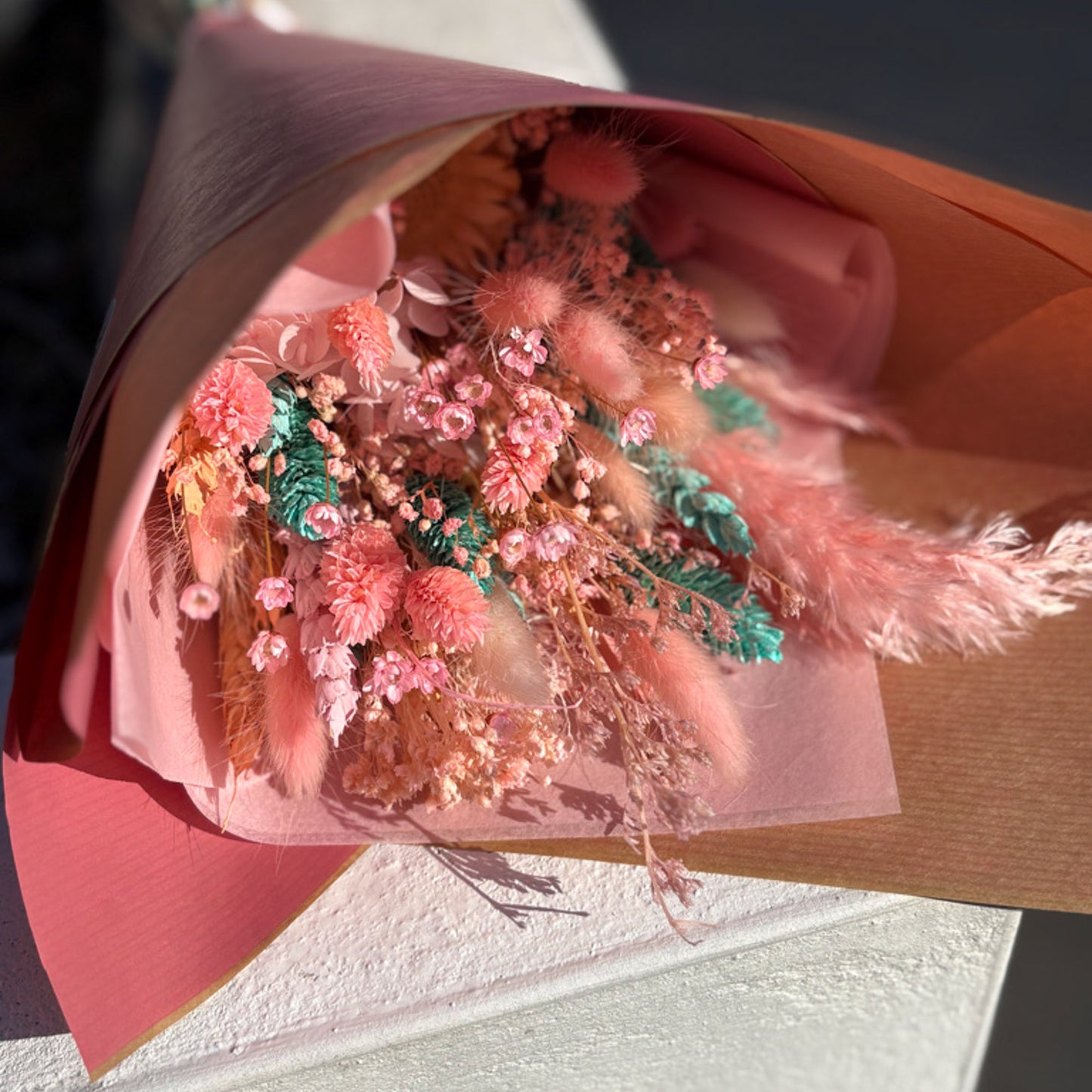 pink and blue dried flower bouquet