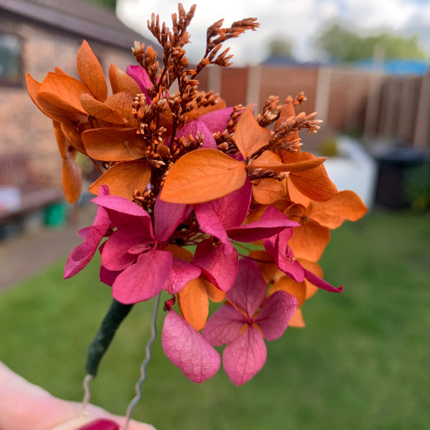 orange and pink dried flower hair pins for fall wedding