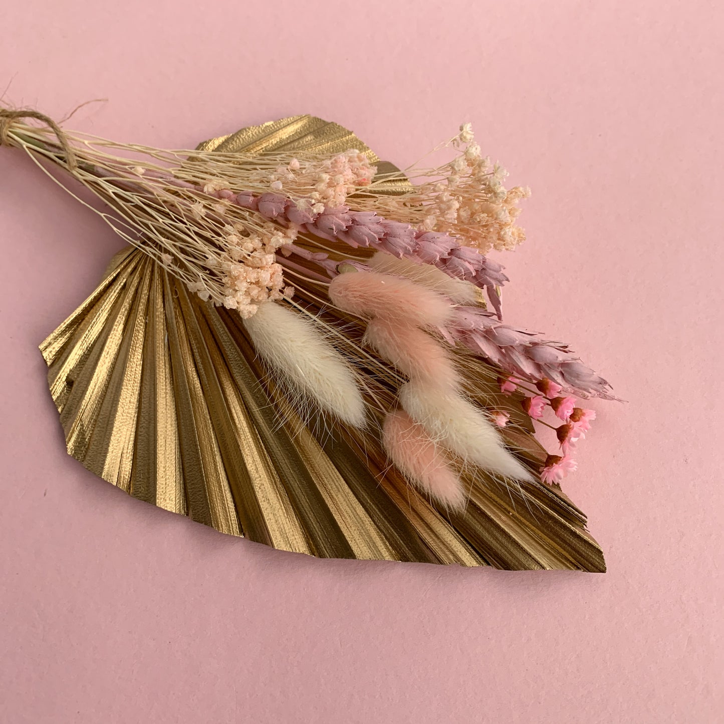 gold palm and dried flower cake topper