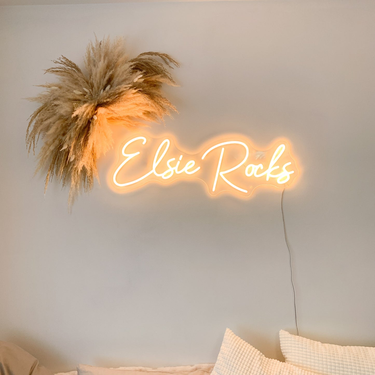 pampas arch and neon studio decor