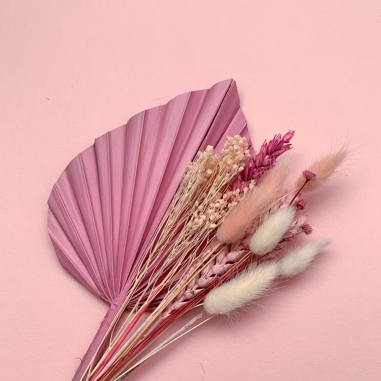 pink palm dried flower cake topper