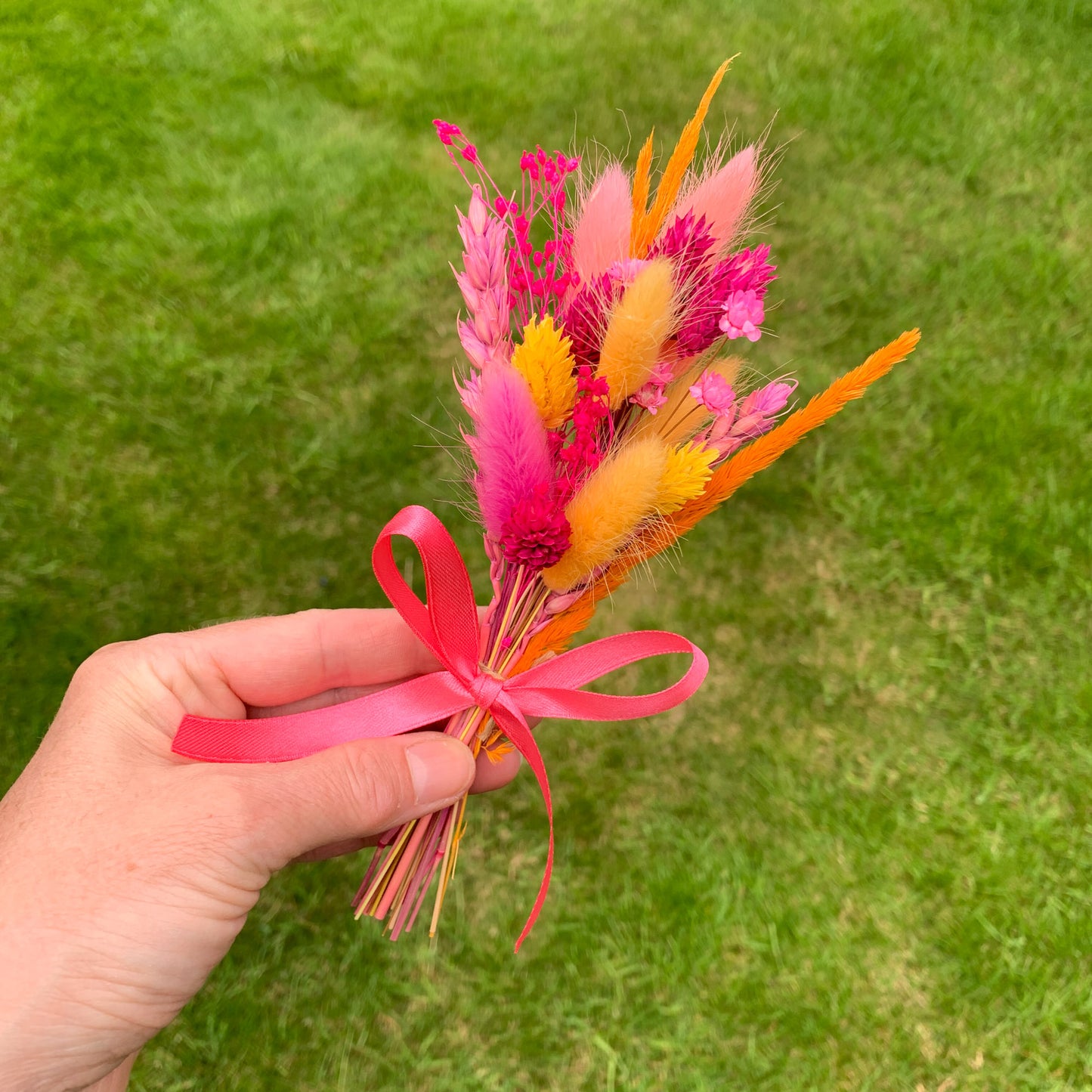 hot pink and orange dried flower bouquet