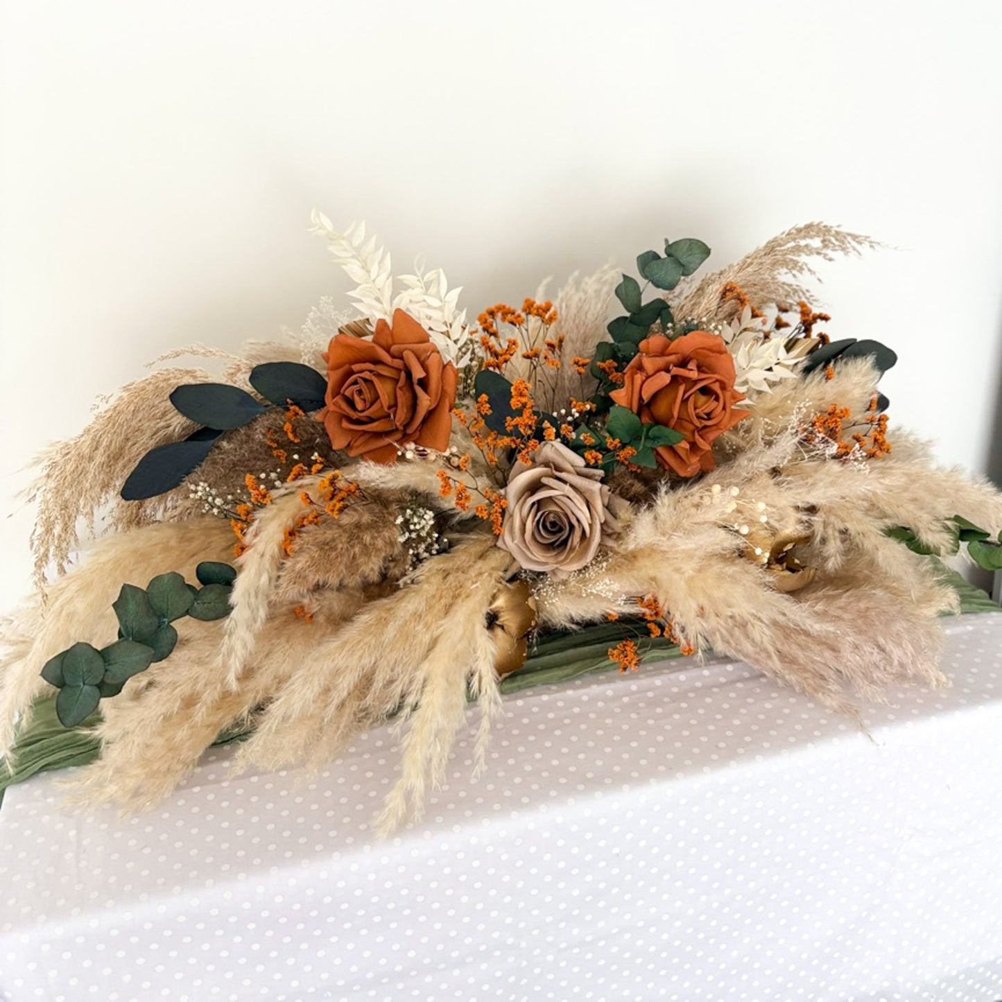 burnt orange top table wedding arrangement
