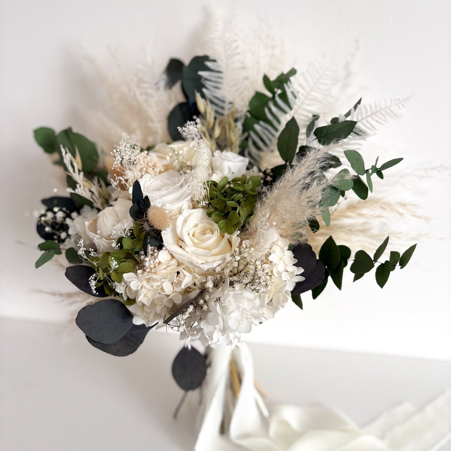 dried flower bridal bouquet with white roses