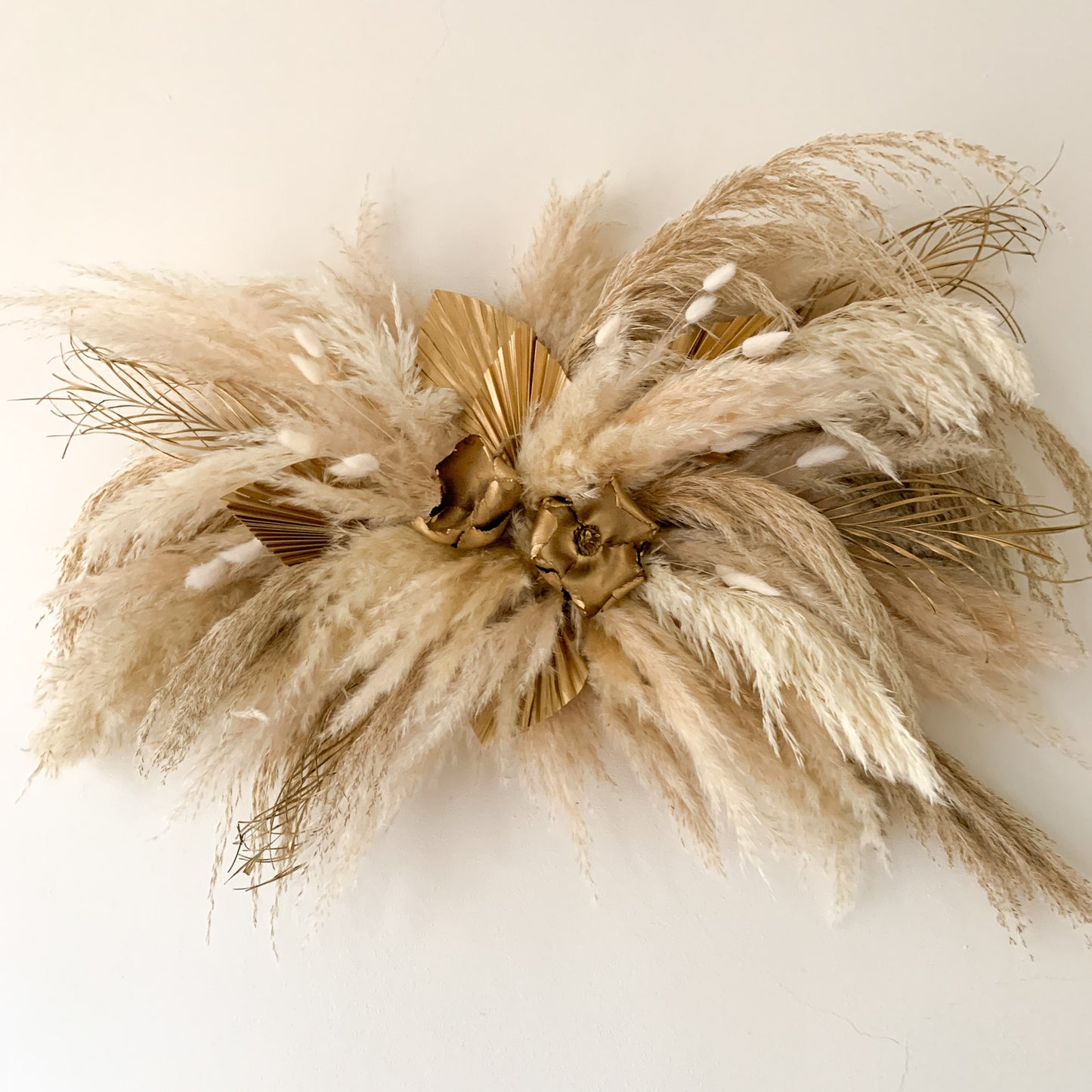 neutral and gold pampas wall arrangement