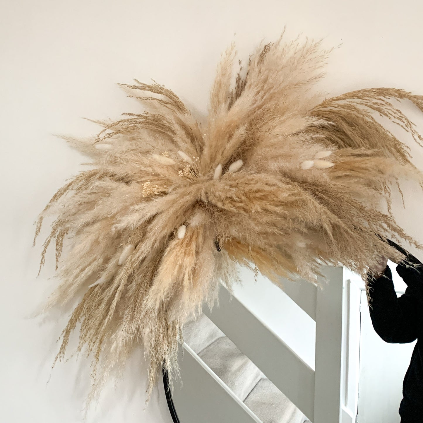 neutral pampas arch for mirror home decor