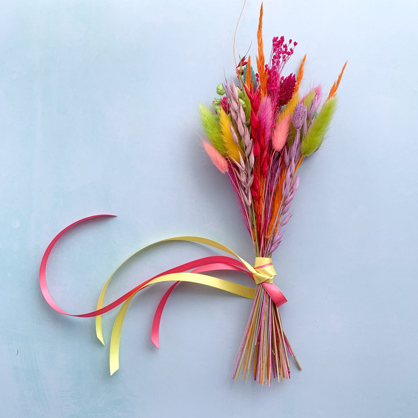 dried flower bouquet in bright rainbow colours
