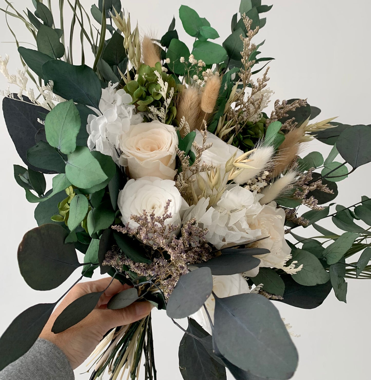 white preserved rose and eucalyptus bridal bouquet