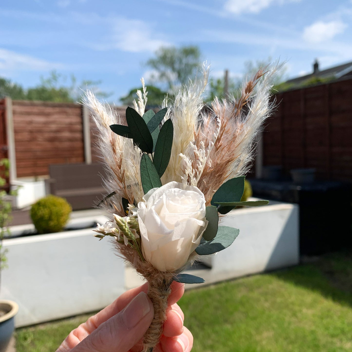 white rose and eucalyptus buttonhole