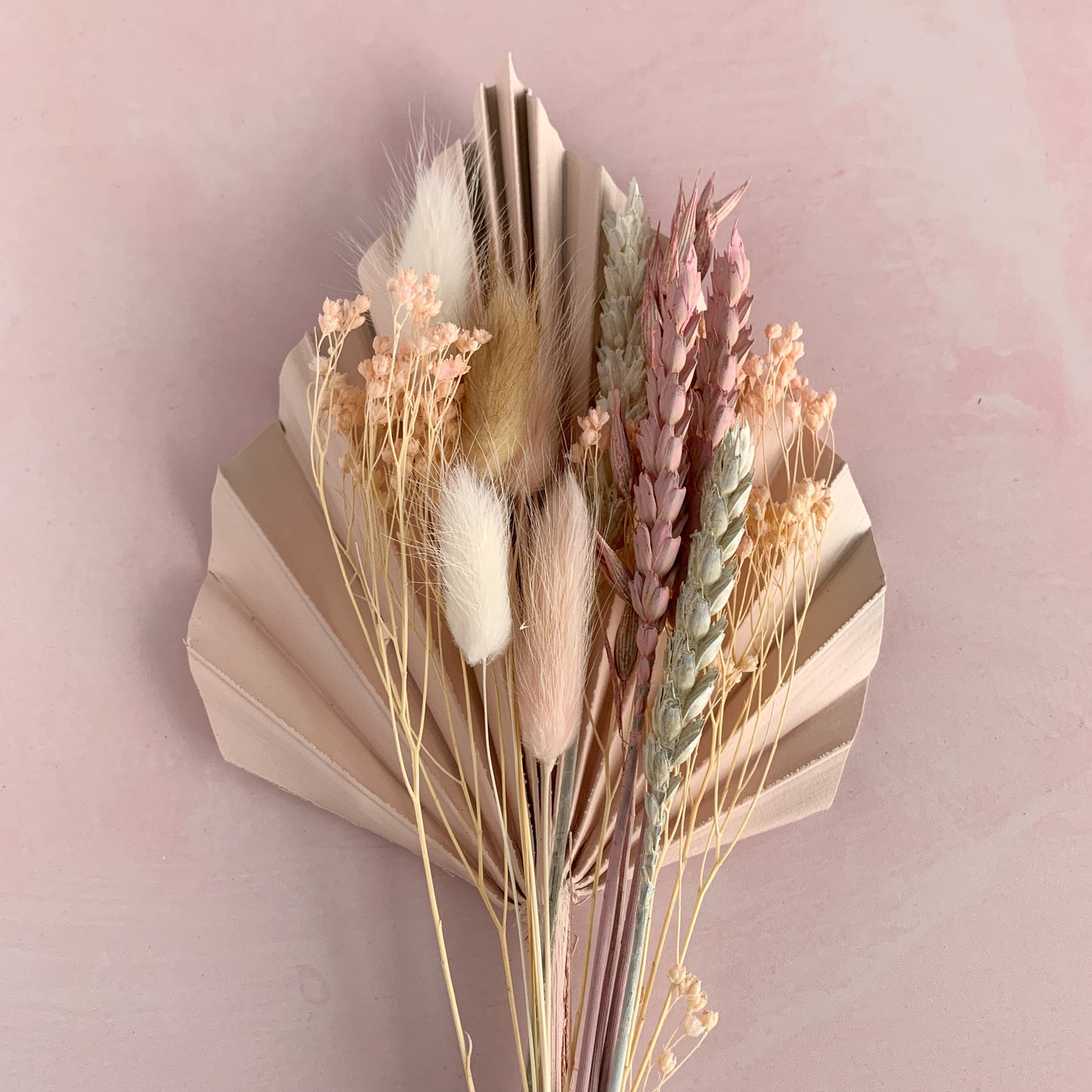 pink blush dried flower cake topper with palm spear