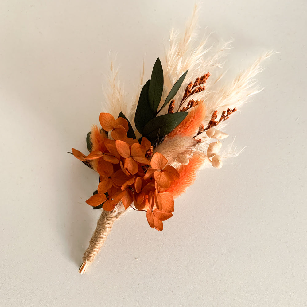 burnt orange dried flower buttonhole