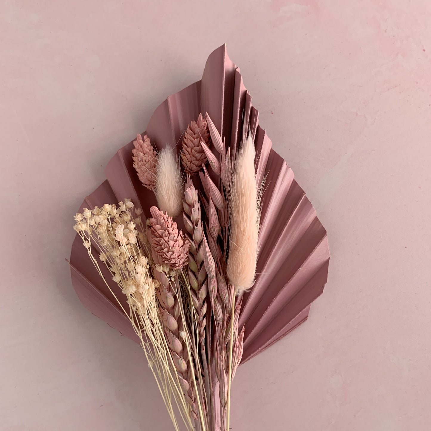 dusky pink dried flower cake topper withe palm spear