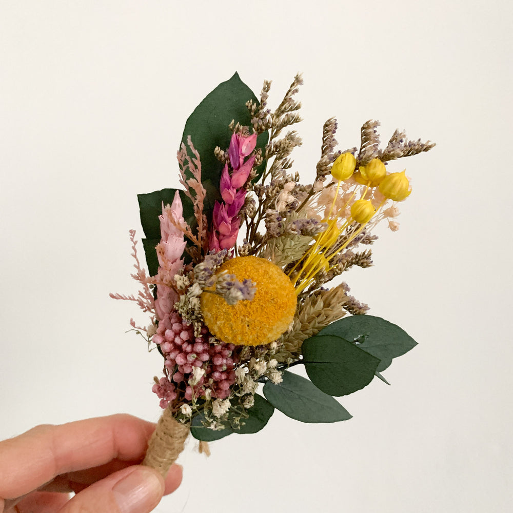 
                      
                        Pink and Yellow Dried flower buttonhole
                      
                    