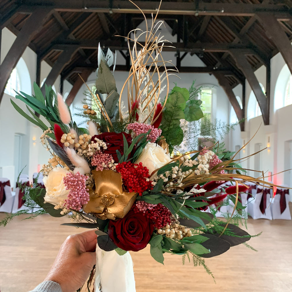 
                      
                        Deep Red Rose and Gold Dried Flower Bridal Bouquet - Winter Garden
                      
                    