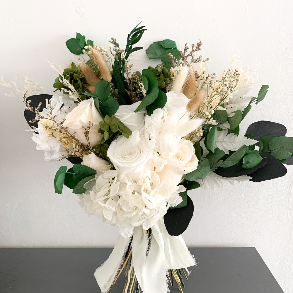 white rose and eucalyptus dried flower bridal bouquet