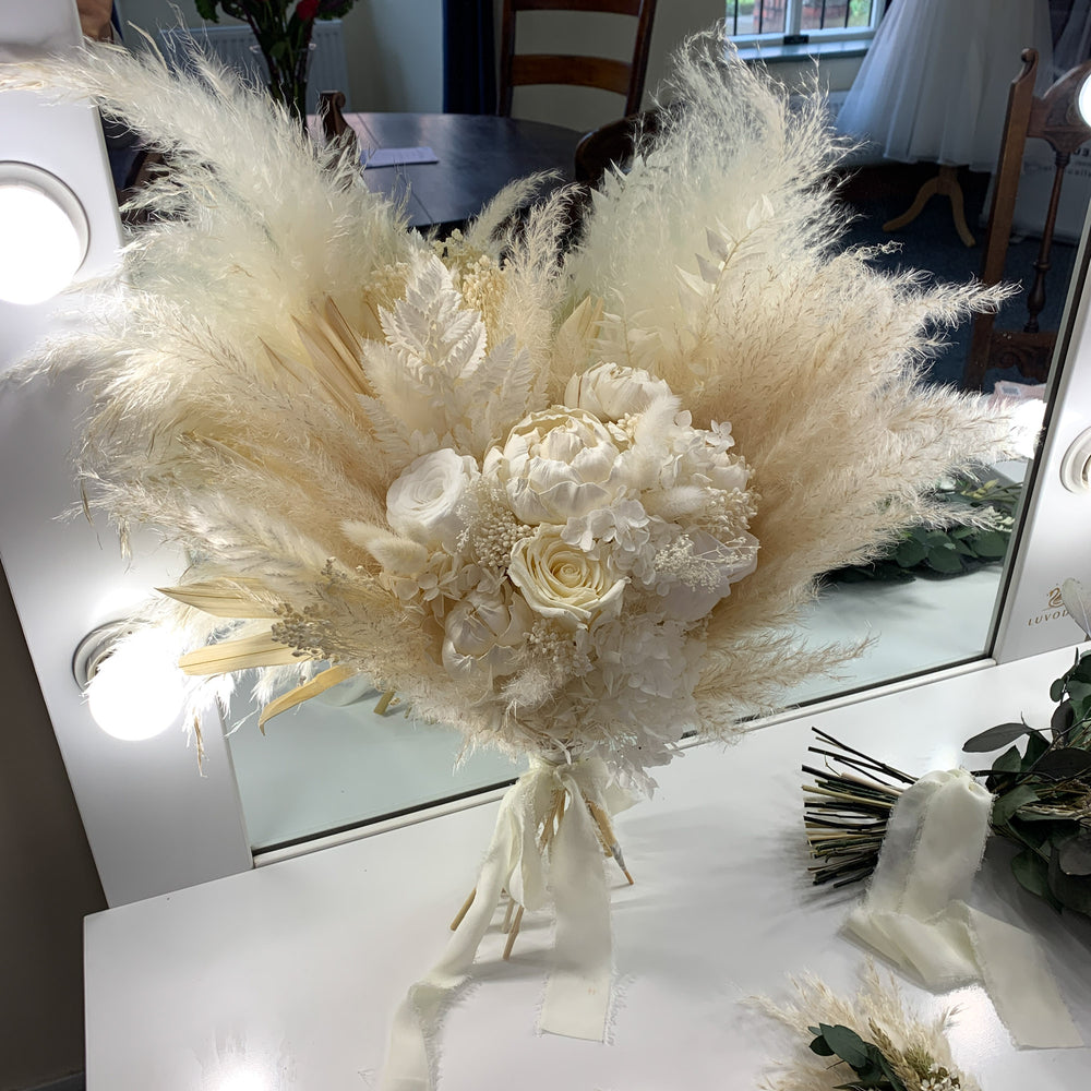 
                      
                        white pampas bridal bouquet with preserved roses
                      
                    