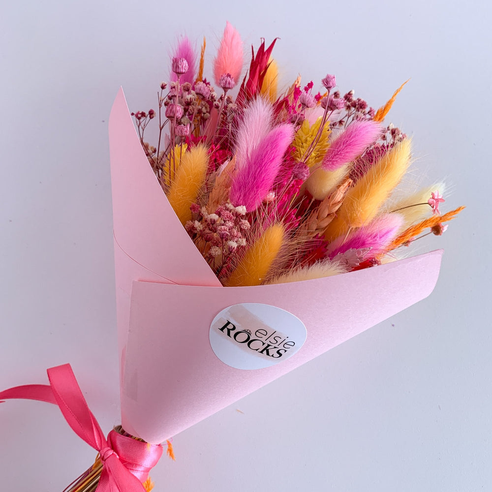 hot pink and orange dried flower bunch