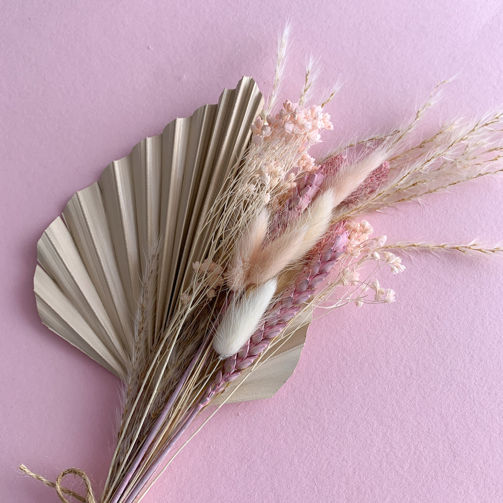 
                      
                        nude palm spear with pink dried flowers
                      
                    