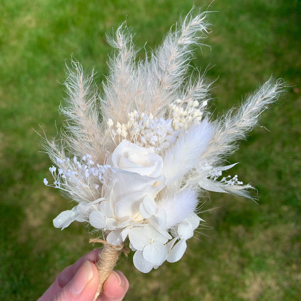 
                      
                        white preserved rose buttonhole
                      
                    