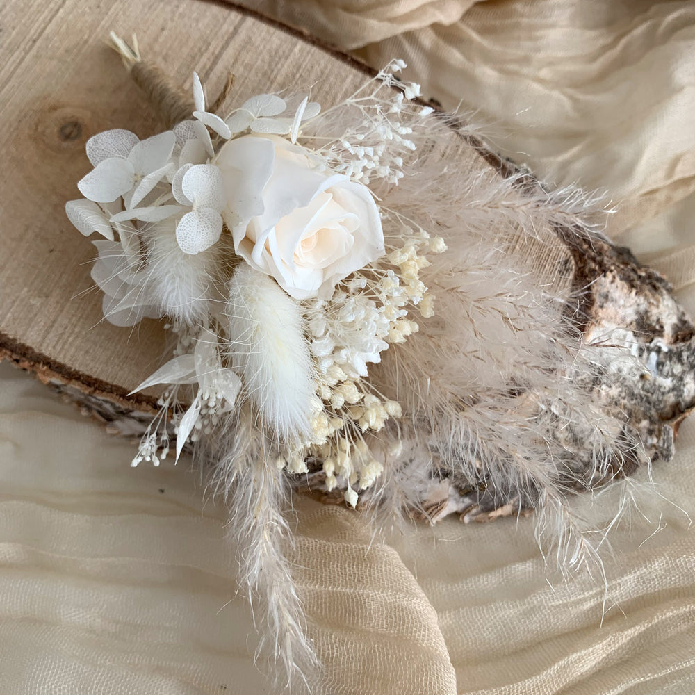 
                      
                        white preserved rose boutonniere
                      
                    